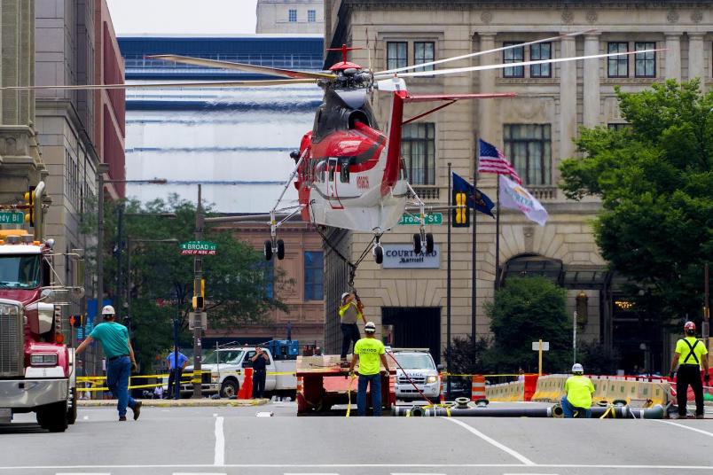 lifting structural steel, piping and four 7,000-lb. cooling tower sections into position atop the 25-story building Helicopter